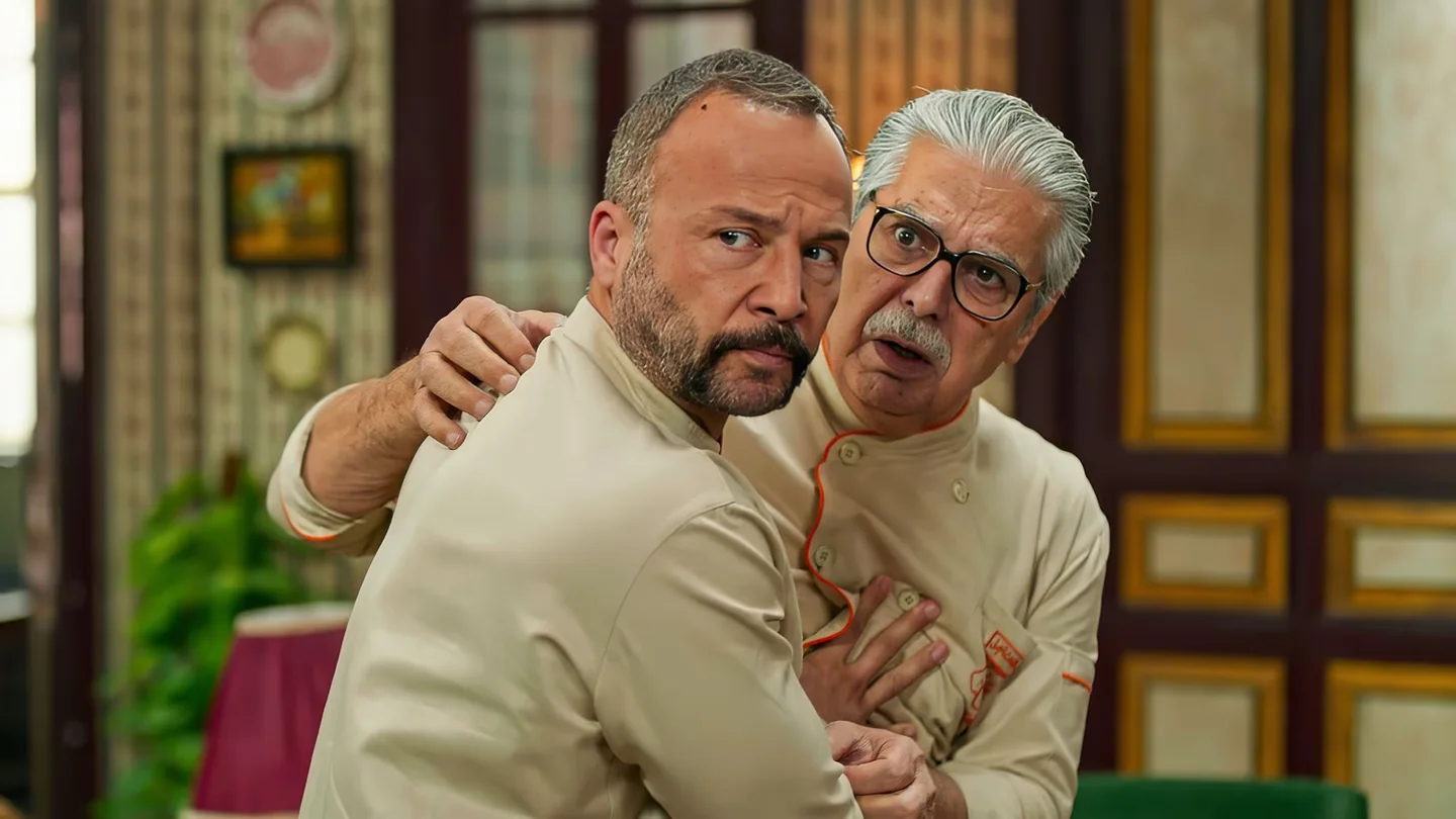 Official Matbakh Al Madina publicity still, two characters in a restaurant kitchen